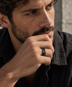 Man wearing the KYNTSU Forged Ring in black stainless steel with gold PVD detailing - view 4